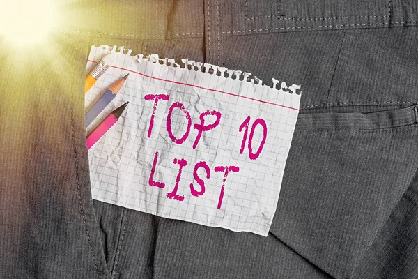 Writing note showing Top 10 List. Business photo showcasing the ten most important or successful items in a particular list Writing equipment and white note paper inside pocket of trousers. — Stock Photo, Image