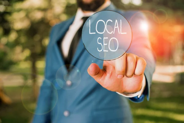 Word writing text Local Seo. Business concept for helps businesses promote products and services to local customers Businessman with pointing finger in front of him. — Stock Photo, Image