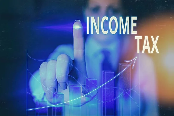 Slovo psaní textu daň z příjmu. Obchodní koncepce pro roční poplatek vybíraný z vydělaných i nevydělaných příjmů. — Stock fotografie