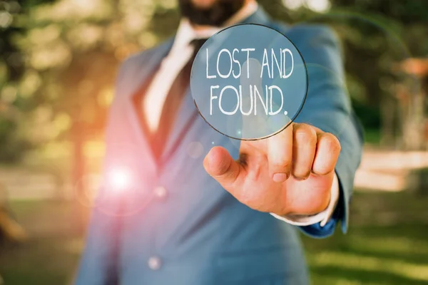 Word writing text Lost And Found. Business concept for a place where lost items are stored until they reclaimed Businessman with pointing finger in front of him. — Stock Photo, Image