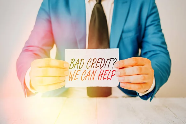 Conceptual hand writing showing Bad Credit Question We Can Help. Business photo text offering help after going for loan then rejected Man holds empty paper with copy space in front of him Space.