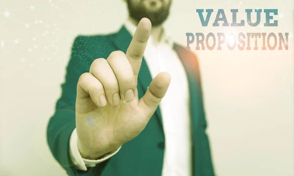 Writing note showing Value Proposition. Business photo showcasing feature intended to make a company or product attractive Businessman with pointing finger in front of him.