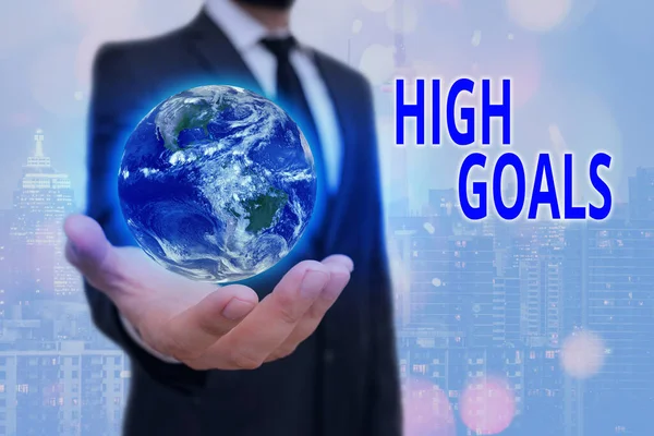 Conceptual hand writing showing High Goals. Business photo text object of demonstrating ambition or effort an aim or desired result Elements of this image furnished by NASA. — Stock Photo, Image