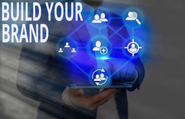 Damganızı İnşa Edin 'i gösteren metin işareti. Reklam kampanyaları kullanarak marka eşitliğini arttıran kavramsal fotoğraf.