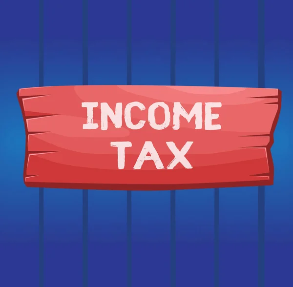 Writing note showing Income Tax. Business photo showcasing Annual charge levied on both earned and unearned income Wooden board rectangle shaped wood attached color background. — Stock Photo, Image