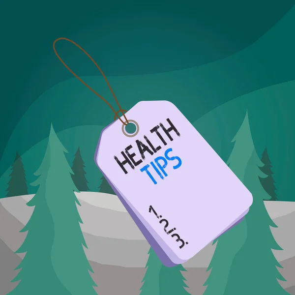 Word writing text Health Tips. Business concept for advice or information given to be helpful in being healthy Label rectangle empty badge attached string colorful background tag small.