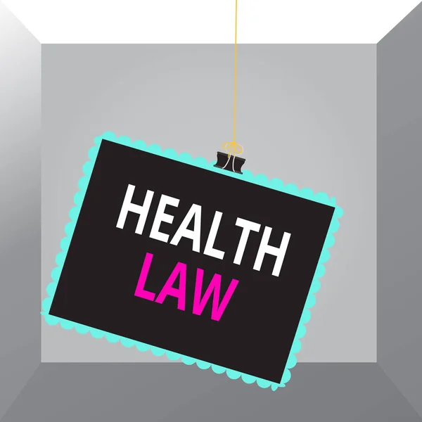 Conceptual hand writing showing Health Law. Business photo text law to provide legal guidelines for the provision of healthcare Stamp stuck binder clip square color frame rounded tip.