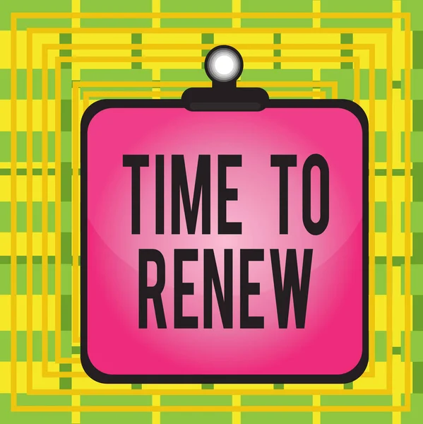 Text sign showing Time To Renew. Conceptual photo extending the period of time when something is valid Clipboard colorful background spring clip stuck bind empty plank frame.