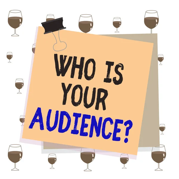 Text sign showing Who Is Your Audience Question. Conceptual photo who is watching or listening to it Paper stuck binder clip colorful background reminder memo office supply.
