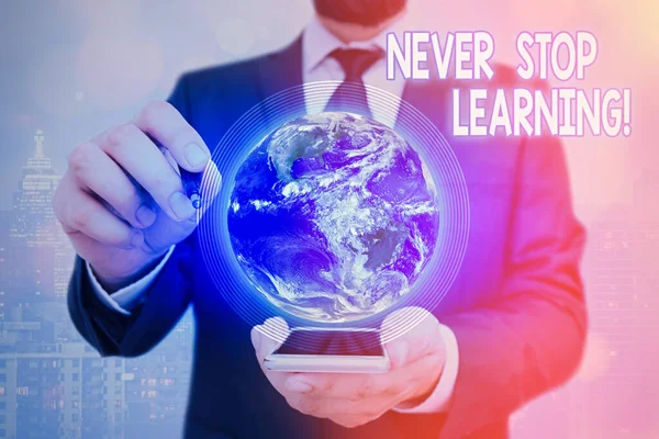 Handwriting text Never Stop Learning. Concept meaning keep on studying gaining new knowledge or materials Elements of this image furnished by NASA. — Stock Photo, Image