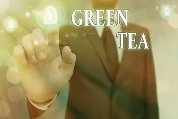 単語の書き込みテキスト緑茶。椿の葉や蕾を使ったお茶のビジネスコンセプト. — ストック写真
