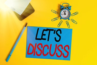 Text sign showing Let Discuss. Conceptual photo asking someone to talk about something with demonstrating or showing Smartphone clock clips paper sheet notepad ballpoint colored background. clipart
