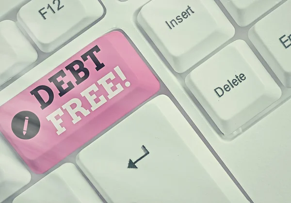 Writing note showing Debt Free. Business photo showcasing does not owning any money to any individual or companies. — Stockfoto