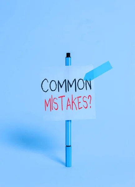 Conceptual hand writing showing Common Mistakes question. Business photo showcasing repeat act or judgement misguided or wrong Ballpoint sticky note arrow banner peaceful cool background. — Stock Photo, Image