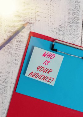 Writing note showing Who Is Your Audience Question. Business photo showcasing who is watching or listening to it Clipboard blank paper sheet pencil notepad old retro wooden background. clipart