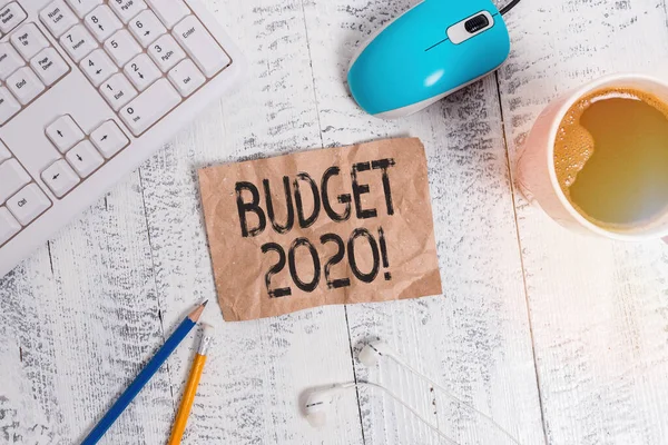 Word writing text Budget 2020. Business concept for estimate of income and expenditure for next or current year technological devices colored reminder paper office supplies keyboard mouse.