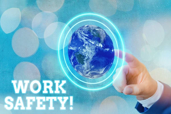 Writing note showing Work Safety. Business photo showcasing policies and procedures in place to ensure health of employees Elements of this image furnished by NASA. — Stock Photo, Image