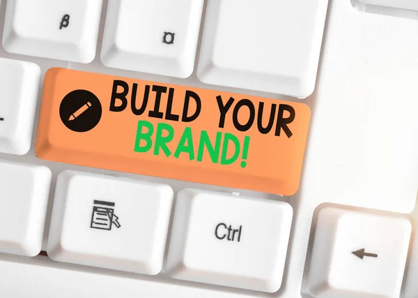 Writing note showing Build Your Brand. Business photo showcasing creates or improves customers knowledge and opinions of product.