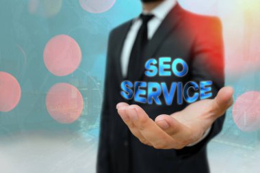 Seo Servisini gösteren kavramsal el yazısı. Web sitesinin görünürlüğünü artırmak için iş fotoğrafı metni teknikleri ve prosedürleri.