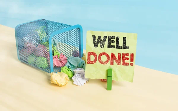 Writing note showing Well Done. Business photo showcasing used praising demonstrating or group for something have done good way Trash bin crumpled paper clothespin reminder office supplies.