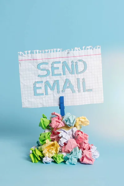 Word writing text Send Email. Business concept for the system for using computers to send messages over the internet Reminder pile colored crumpled paper clothespin reminder blue background. — Stock Photo, Image