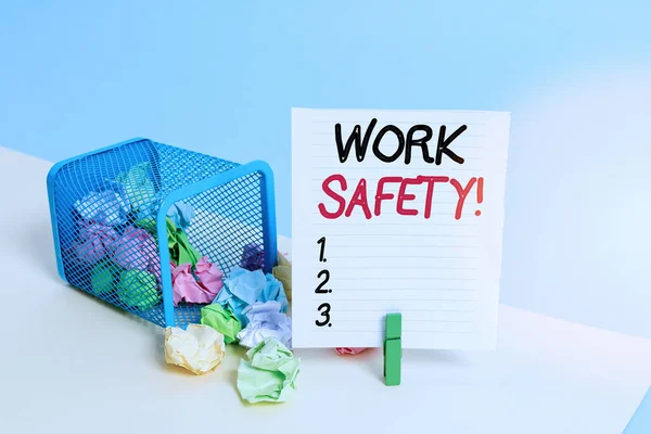 Conceptual hand writing showing Work Safety. Business photo showcasing policies and procedures in place to ensure health of employees Trash bin crumpled paper clothespin reminder office supplies.