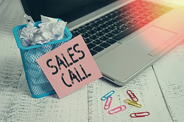 Conceptual hand writing showing Sales Call. Business photo showcasing a phone call made by a sales representative of a company Metallic laptop sticky note bin paper clips vintage table.