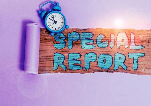 Text sign showing Special Report. Conceptual photo the latebreaking news Special coverage or news flash Alarm clock and torn cardboard placed above a wooden classic table backdrop.