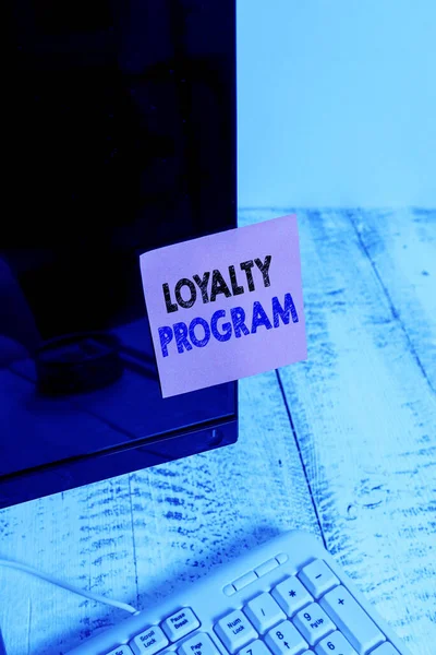 Conceptual hand writing showing Loyalty Program. Business photo showcasing marketing effort that provide incentives to repeat customers Notation paper computer monitor screen near white keyboard. — 图库照片