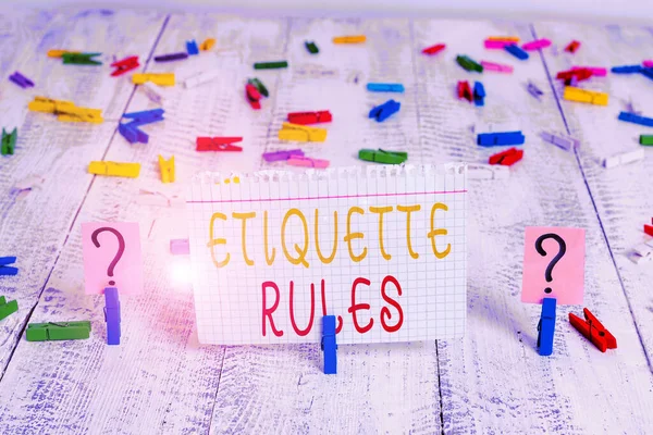 Word writing text Etiquette Rules. Business concept for customs that control accepted behaviour in social groups Scribbled and crumbling sheet with paper clips placed on the wooden table. — Stock Photo, Image