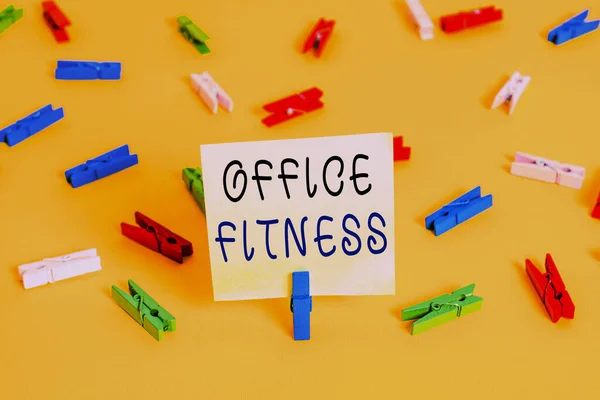 Writing note showing Office Fitness. Business photo showcasing Encouraging fitness and balance lifestyle in the workplace Colored clothespin papers empty reminder yellow floor background office. — 图库照片