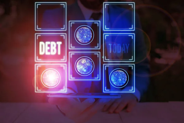 Word writing text Debt. Business concept for a sum of money that a demonstrating or organization owes to someone or a bank Elements of this image furnished by NASA. — Stockfoto