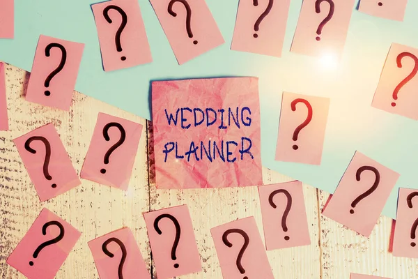 Handwriting text Wedding Planner. Concept meaning someone who plans and organizes weddings as a profession Scribbled and crumbling papers with thick cardboard above wooden table.
