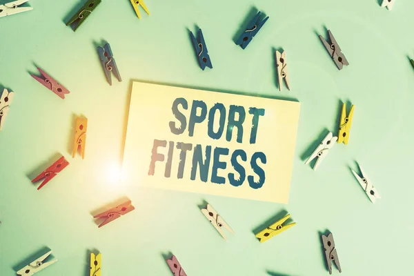 Conceptual hand writing showing Sport Fitness. Business photo text Conditioning athletes for the unique Demands of their sports Colored clothespin rectangle shaped paper blue background. — Stockfoto