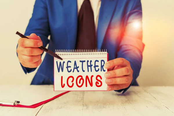 Text sign showing Weather Icons. Conceptual photo Plotted on a synoptic chart used for weather forecasting Man holds empty paper with copy space in front of him Copy Space. — Stock fotografie