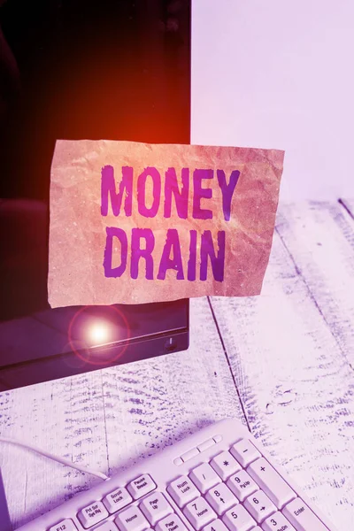 Writing note showing Money Drain. Business photo showcasing To waste or squander money Spend money foolishly or carelessly Notation paper computer monitor screen near white keyboard. — 스톡 사진