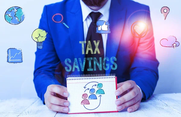 Word writing text Tax Savings. Business concept for only a portion of income is taxable Pay a reduced amount of tax.