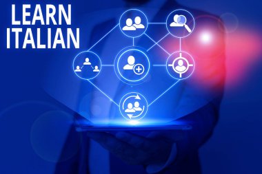 Writing note showing Learn Italian. Business photo showcasing gain or acquire knowledge of speaking and writing Italian.