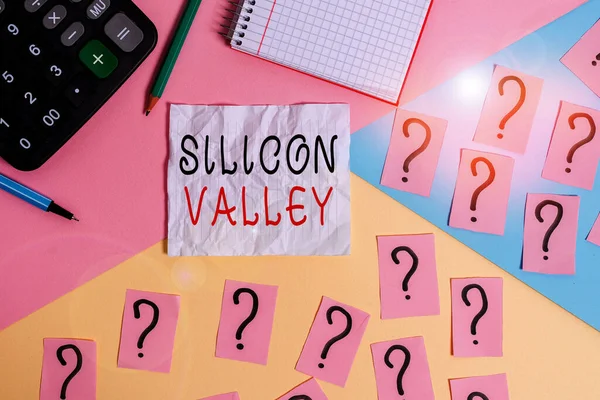 Handwriting text writing Silicon Valley. Concept meaning home to analysisy startup and global technology companies Mathematics stuff and writing equipment above pastel colours background.
