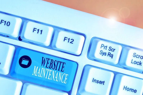 Conceptual hand writing showing Website Maintenance. Business photo showcasing act of regularly checking your website for issues.