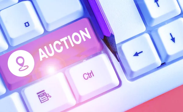 Handwriting text writing Auction. Concept meaning Public sale Goods or Property sold to highest bidder Purchase.