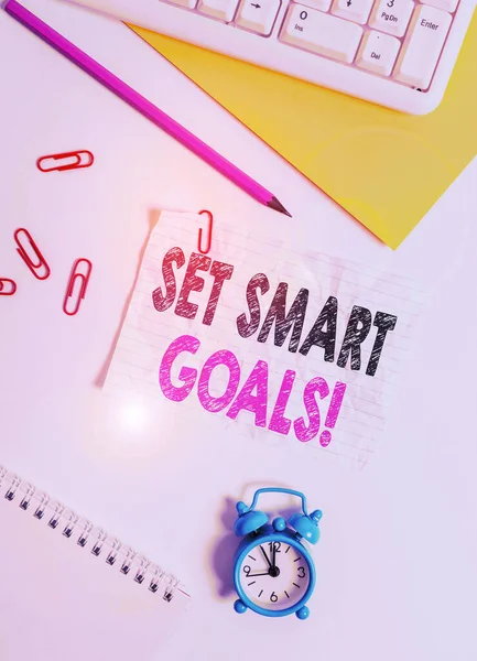 Text sign showing Set Smart Goals. Conceptual photo list to clarify your ideas focus efforts use time wisely Flat lay above white blank paper with copy space for text messages. — Stock Photo, Image