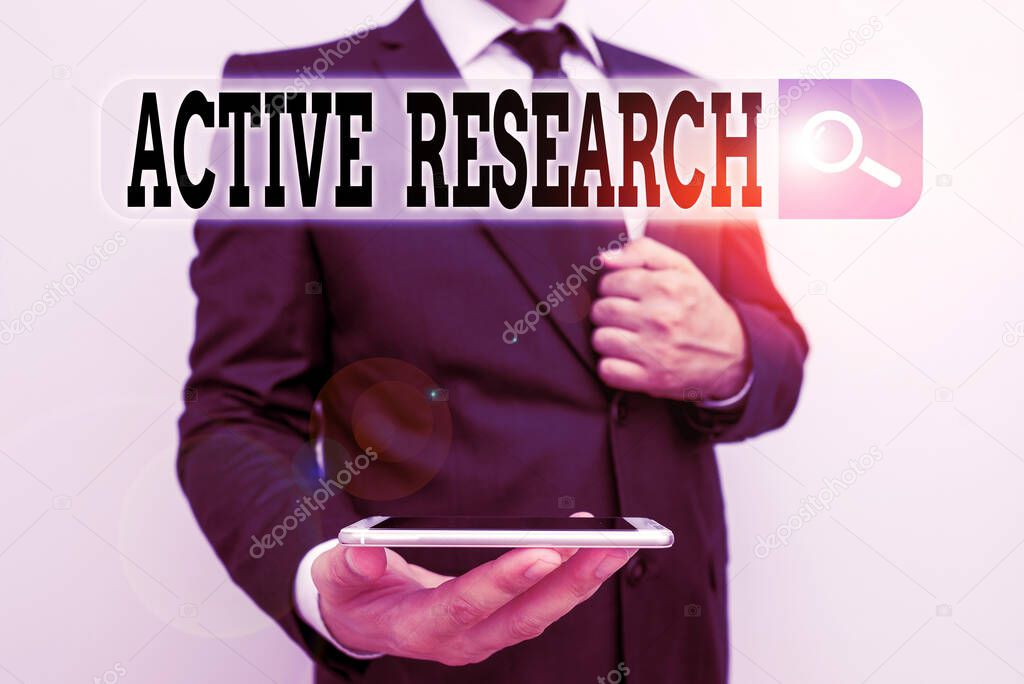 Word writing text Active Research. Business concept for Simultaneous process of taking action and doing research Male human wear formal work suit hold smart hi tech smartphone use one hand.