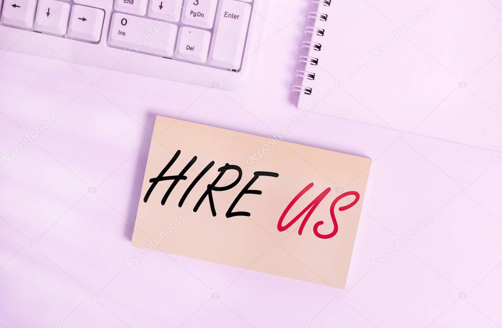 Text sign showing Hire Us. Conceptual photo Used by resources indicate employee that he is got job Empty note paper on the white background by the pc keyboard with copy space.