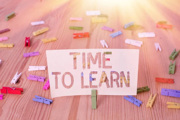 Text sign showing Time To Learn. Conceptual photo the need to get knowledge or understanding of facts and ideas Colored clothespin papers empty reminder wooden floor background office. — Stock Photo, Image