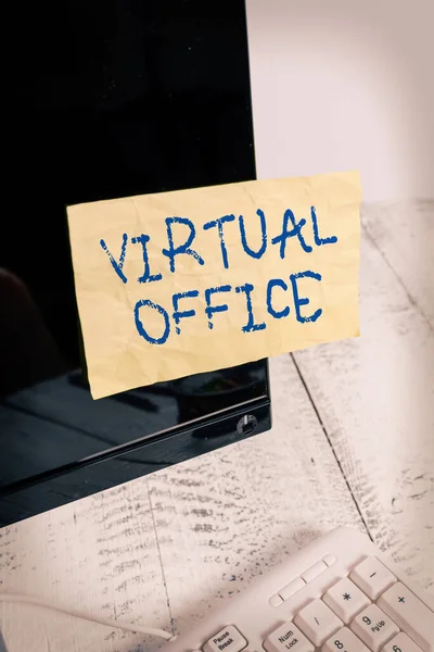 Writing note showing Virtual Office. Business photo showcasing operational domain of any business or organization virtually Notation paper computer monitor screen near white keyboard. — Stock Photo, Image