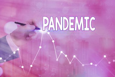 Pandemiyi gösteren kavramsal el yazısı. İş fotoğraflarının geniş bir alana yayılması nüfusun yüksek oranını etkiliyor.