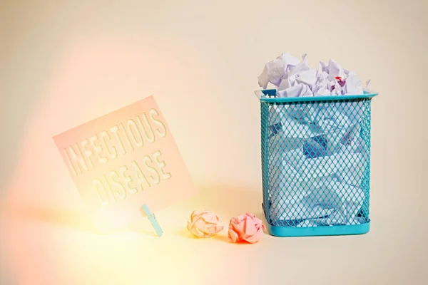 Writing note showing Infectious Disease. Business photo showcasing caused by pathogenic microorganism, such as viruses, etc Note paper and stationary placed above soft pastel colour backdrop. — Stock Photo, Image