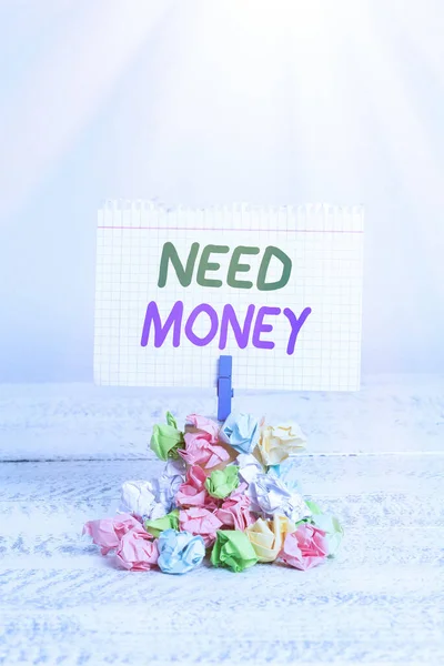 Text sign showing Need Money. Conceptual photo require a financial assistance to sustain spending or endeavor Reminder pile colored crumpled paper clothespin reminder white wooden space. — Stock Photo, Image