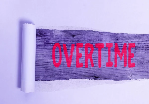 Conceptual hand writing showing Overtime. Business photo text Time or hours worked in addition to regular working hours. — Stock Photo, Image